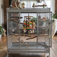 Large stainless steel cockatoo cage with foraging toys and a play stand attachment